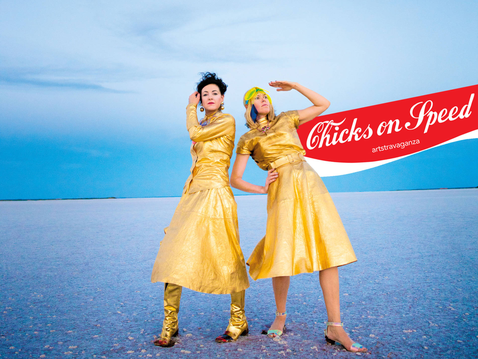 Chicks on Speed promotional image with two people in gold clothing beside the band name
